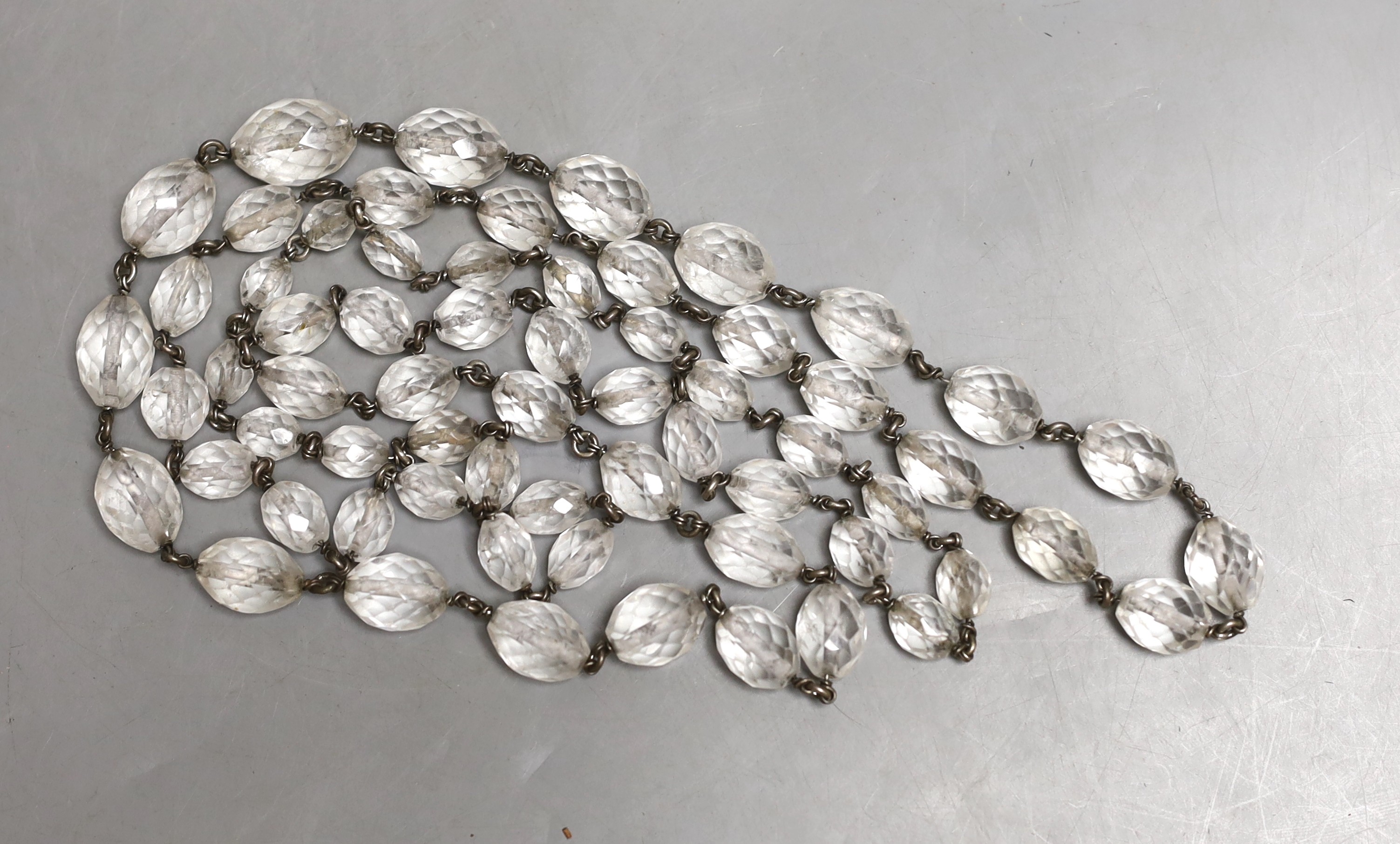 A white metal and facetted rock crystal necklace, 138cm.